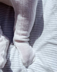 Baby broekje met voetjes - Wol & zijde - Naturel